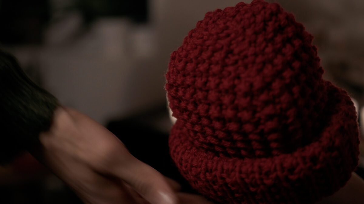 Double thread wool beanie being grabbed.