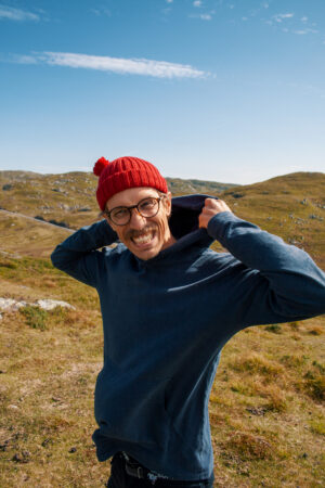 Wearing beanie with pom-pom in Norwegian mountains.