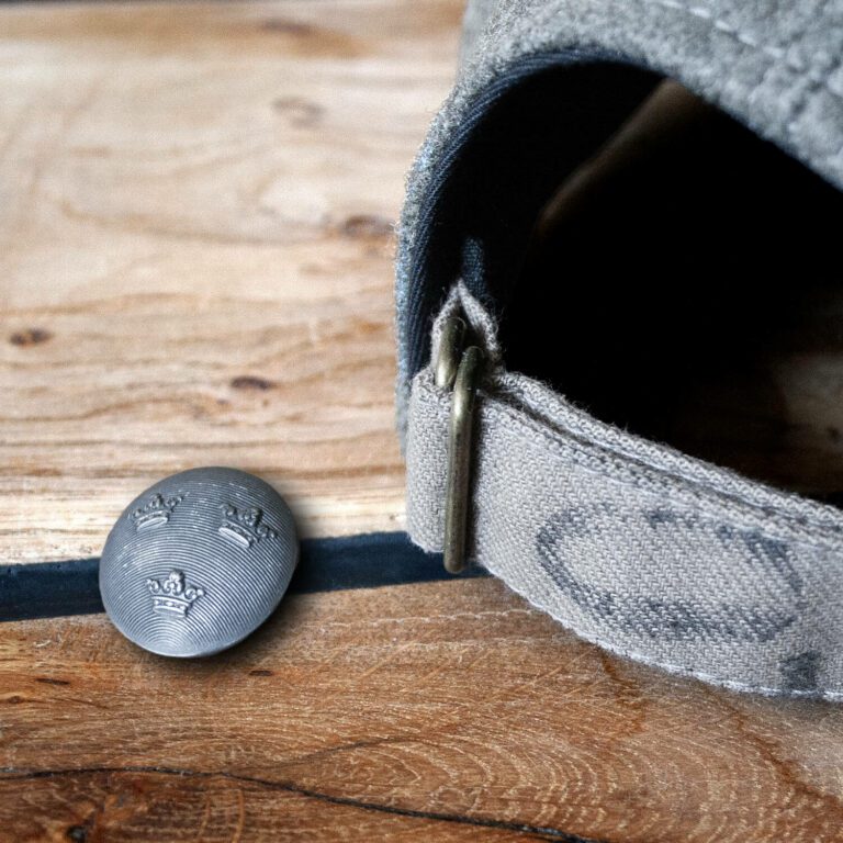 Hand crafted wool cap strap detail
